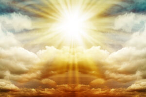 Panorama. Fog and clouds looking up into a fantasy colored sky. The bright sun illuminates the whole picture.